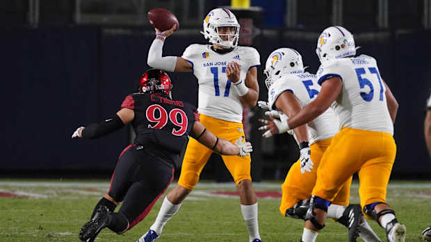 Nov 6, 2020; Carson, California, USA; San Jose State Spartans quarterback Nick Starkel (17) throws a pass under pressure from San Diego State Aztecs defensive lineman Cameron Thomas (99)in the first half at Dignity Health Sports Park. Mandatory Credit: Kirby Lee-USA TODAY Sports